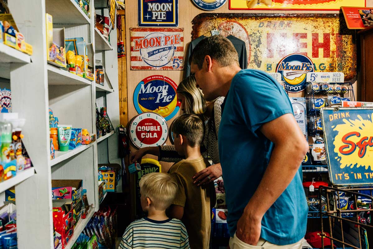A family browsing snacks at the Dixie Country Store.