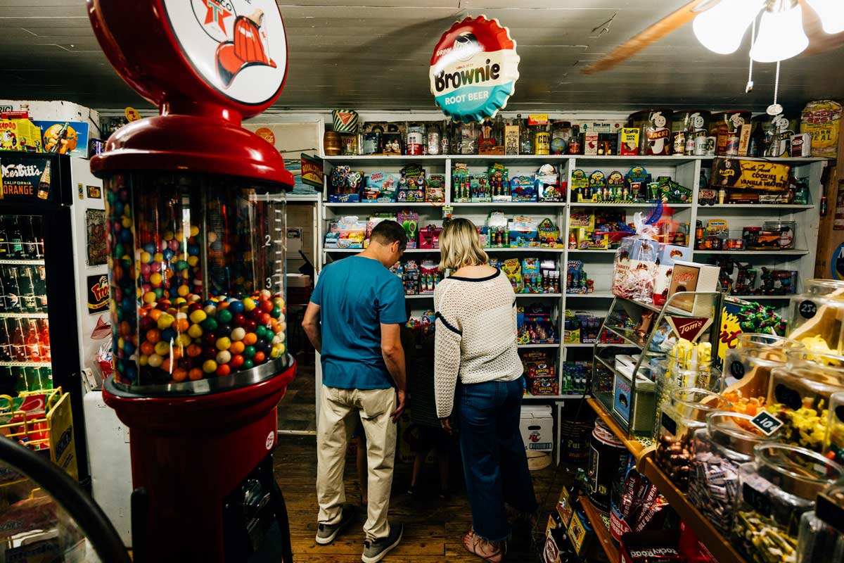 A couple looking through snacks at the Dixie Country Store.
